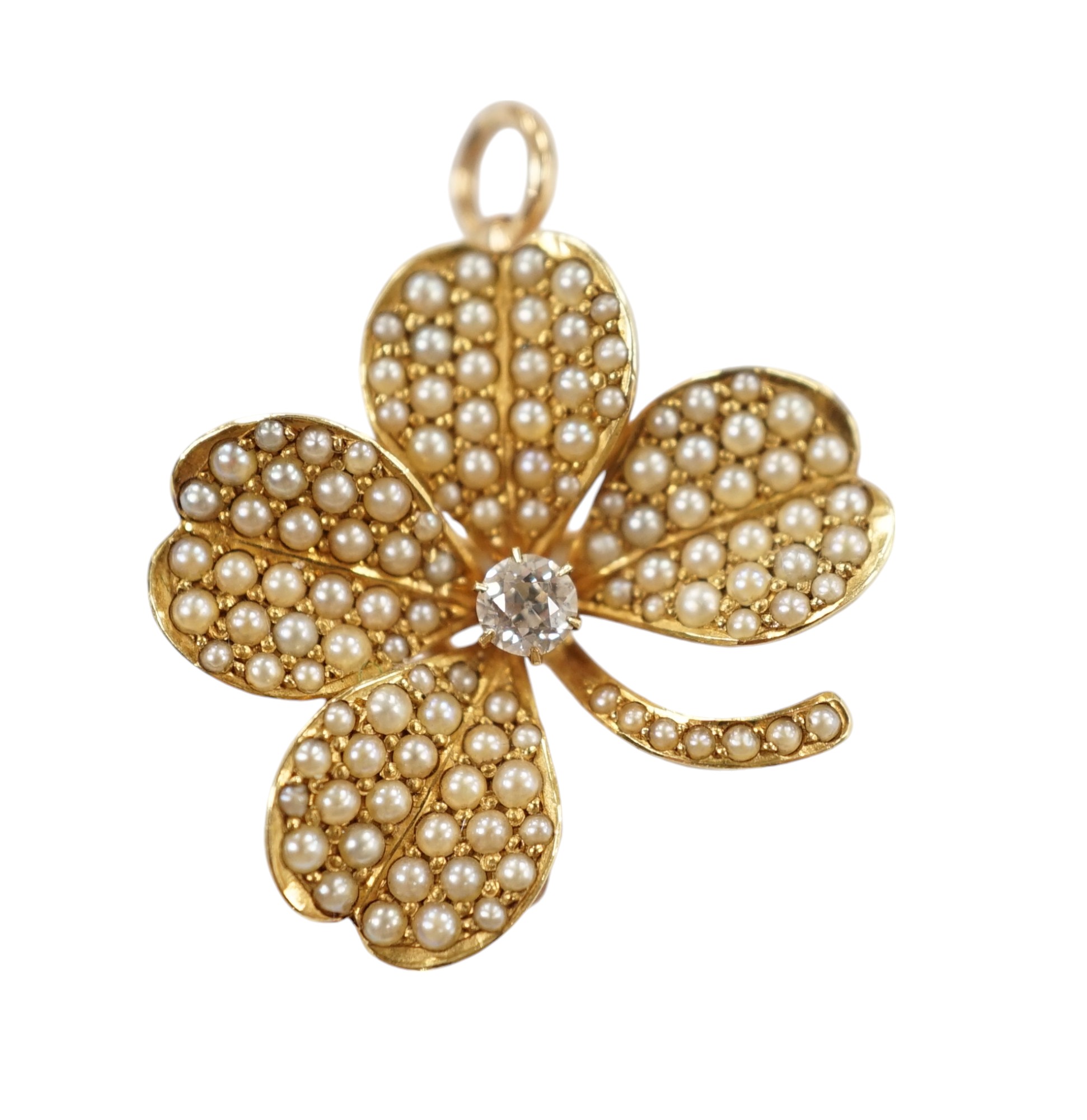 A 14k diamond and seed pearl set clover pendant brooch, width 21mm, gross weight 4.8 grams. Condition - fair to good